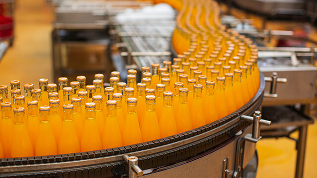 Conveyor belt with juice bottles